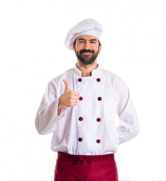 Chef con el pulgar hacia arriba sobre fondo blanco