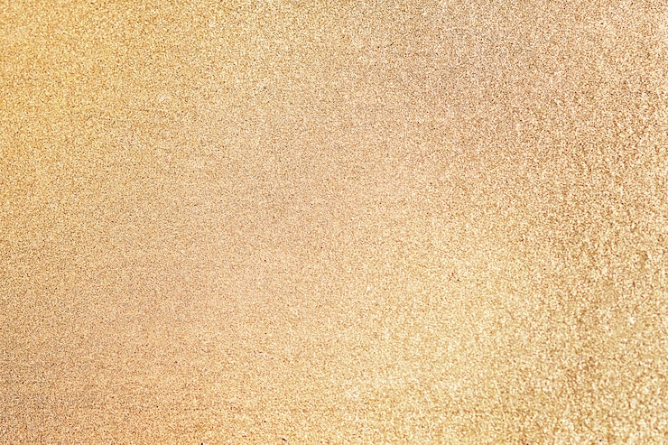 Foto gratuito cierre para arriba del fondo texturizado brillo de oro