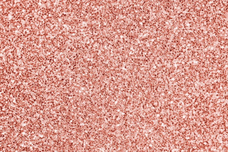 Foto gratuito cierre para arriba del fondo texturizado brillo rosado