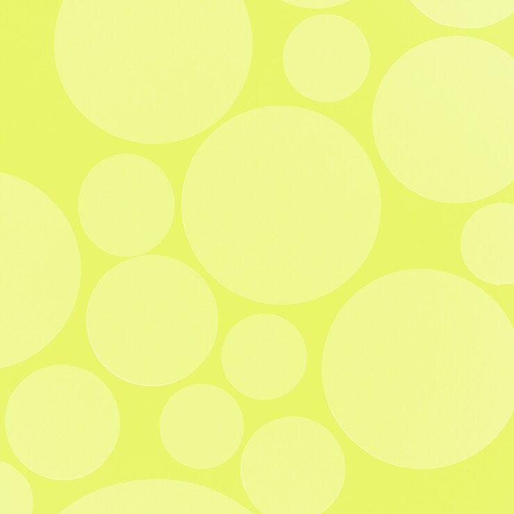 Foto gratuito círculo de enfoque suave sobre fondo amarillo para tarjeta