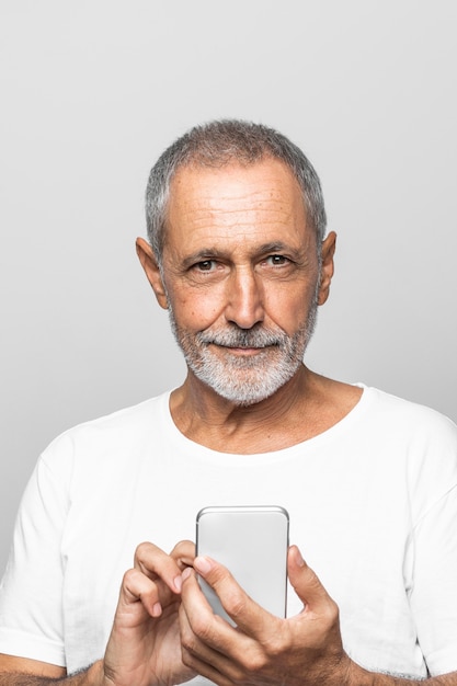 Close-up smiley man holding smartphone