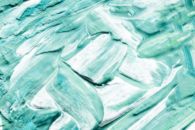 Close-up de trazos de pincel de pintura azul en la superficie