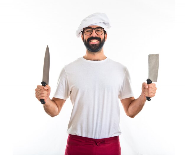 Cocinero sosteniendo cuchillos