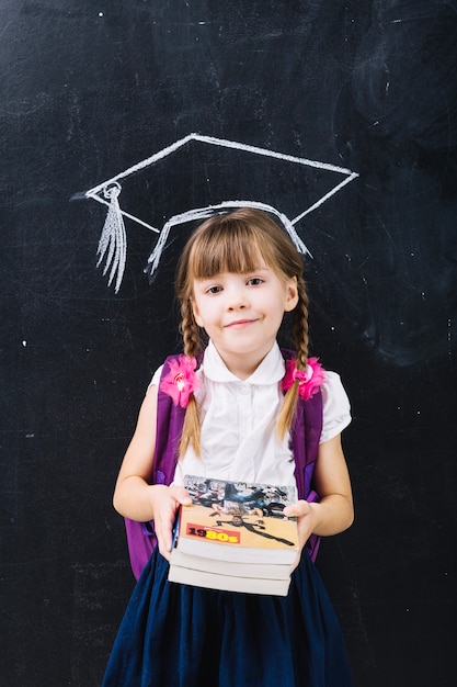 Foto gratuita colegiala linda en sombrero principal