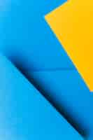 Foto gratuita color de dos tonos de fondo de papel azul y amarillo.