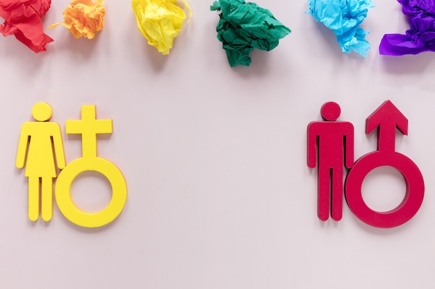 Colorido papel motolite con símbolos de género