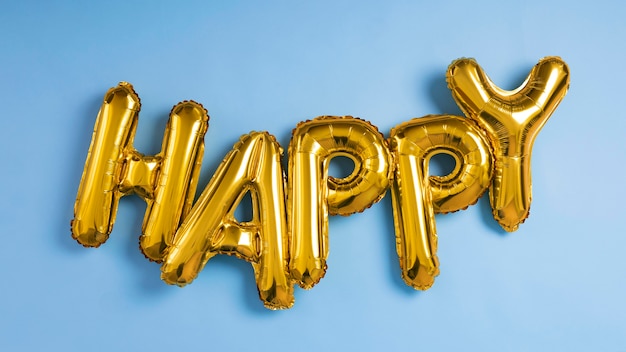 Foto gratuita composición de globos de letras felices