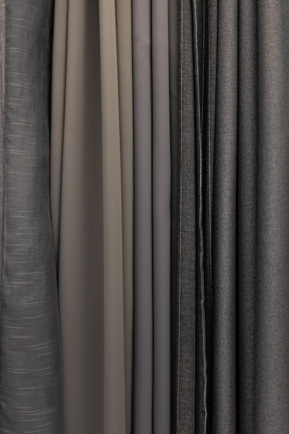 Conjunto de tejidos grises densos de textura uniforme, elección de materiales en colores grises.