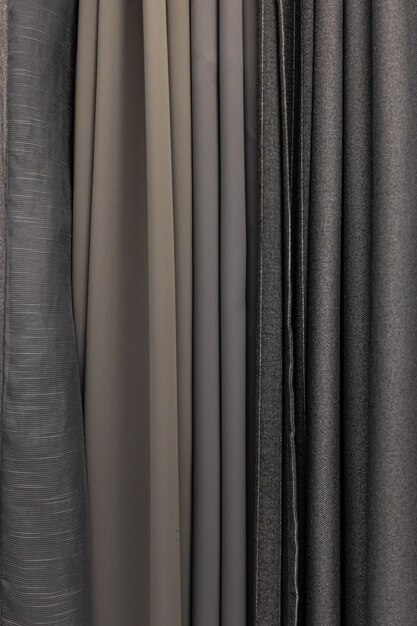 Conjunto de tejidos grises densos de textura uniforme, elección de materiales en colores grises.