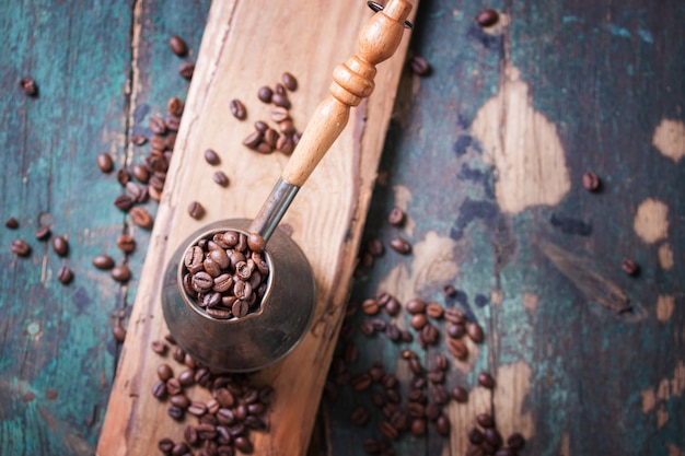 Copper utensil with coffee beans