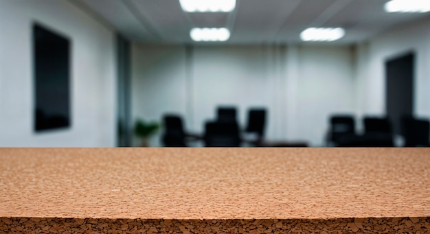Cork surface and office interior in blurred background
