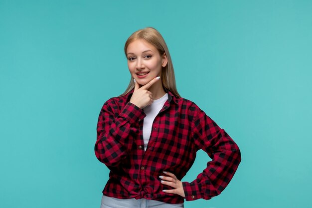 Día internacional de los estudiantes feliz joven linda chica en camisa roja a cuadros sonriendo