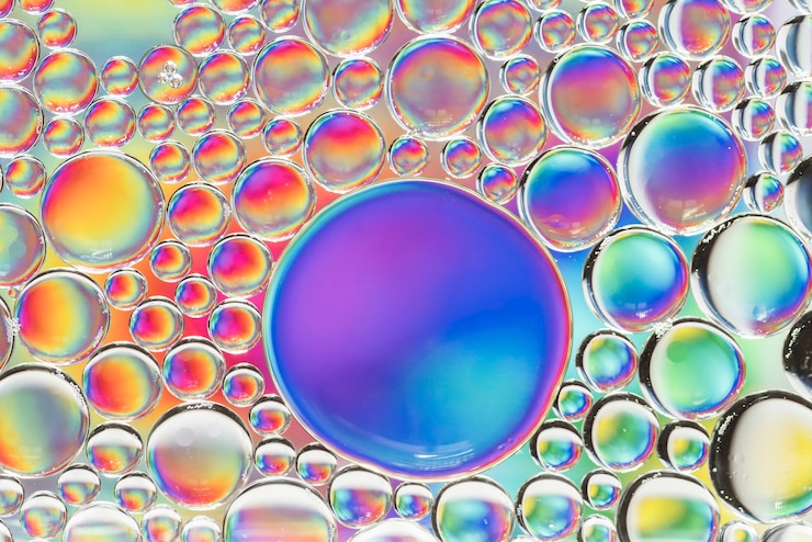 Foto gratuito diferente textura de burbujas de arco iris abstracto
