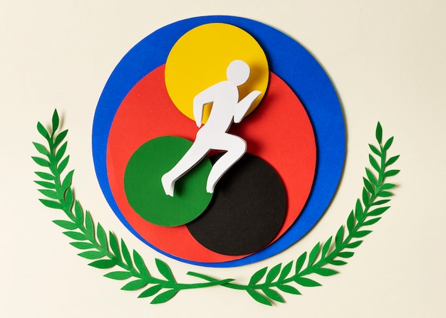 Foto gratuita disposición de atleta en estilo papel sobre círculos coloridos