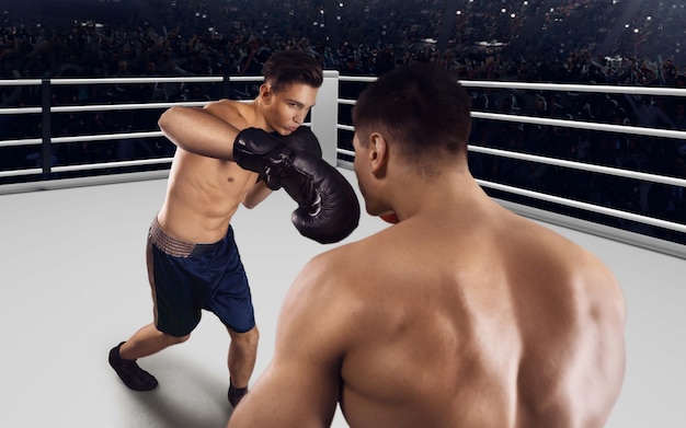 Dos boxeadores peleando en un ring de boxeo profesional