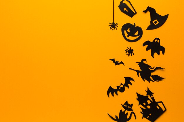 Elementos de fiesta de Halloween sobre fondo naranja