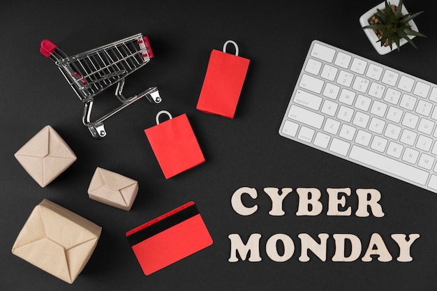 Elementos de venta de cyber monday de vista superior sobre fondo oscuro