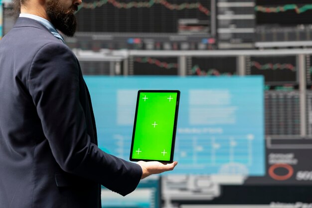 Entrepreneur holds tablet with copy space screen and leveraging dashboards