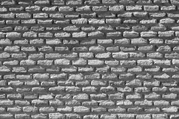 Envejecida pared de ladrillo de color gris claro