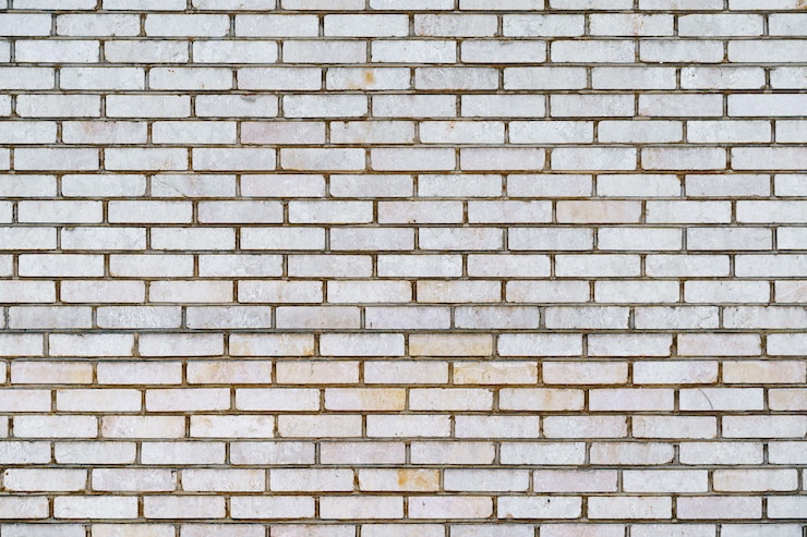 Foto gratuito espacio de copia de fondo de pared de ladrillo antiguo blanco