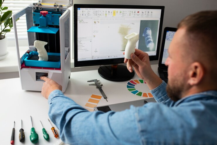 Foto gratuito el estilo de vida del diseñador usando una impresora 3d.