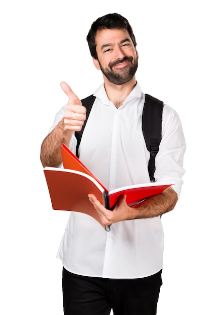 Foto gratuita estudiante hombre con el pulgar hacia arriba