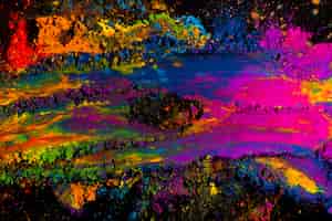 Foto gratuita explosión de polvo holi multicolor abstracta sobre fondo negro