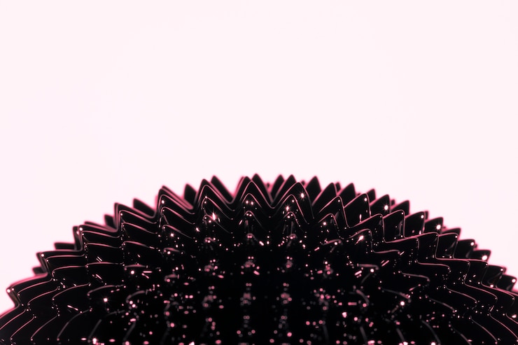 Photo Gratis ferromagnetic liquid metal with copy space on pink background