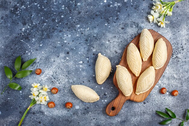 Fiesta tradicional de Azerbaiyán Novruz dulces shekerburas.