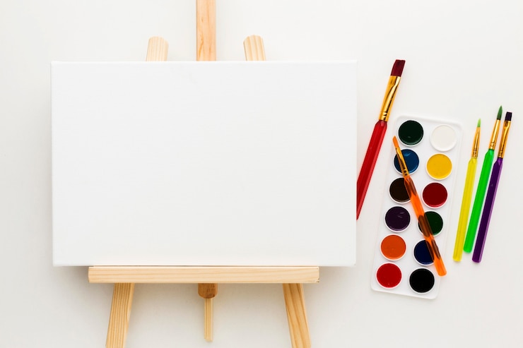 Photo Gratis flat lay easel and watercolor paint