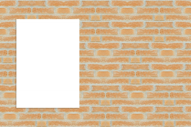 Foto gratuito folio en blanco sobre pared de ladrillos