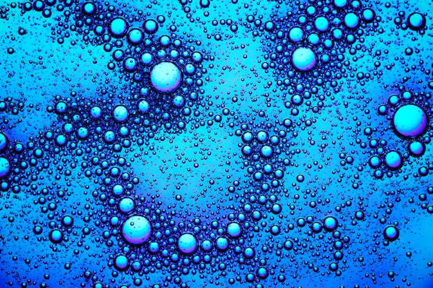 Fondo abstracto azul burbuja de aceite abstracto en papel tapiz de agua