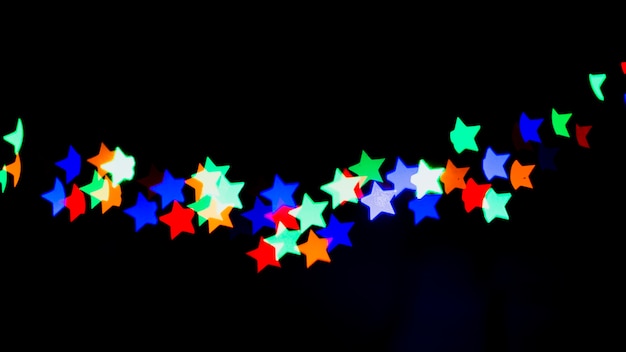 Foto gratuita fondo abstracto bokeh con luces en forma de estrellas