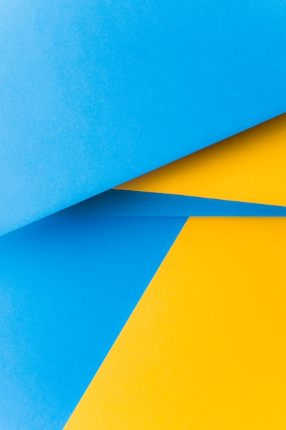 Fondo abstracto de papel amarillo y azul en blanco