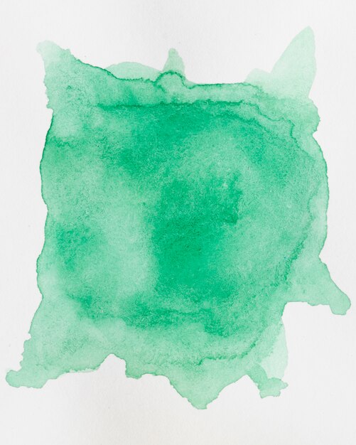 Fondo de acuarela abstracta con una salpicadura de sombra esmeralda de pintura de acuarela