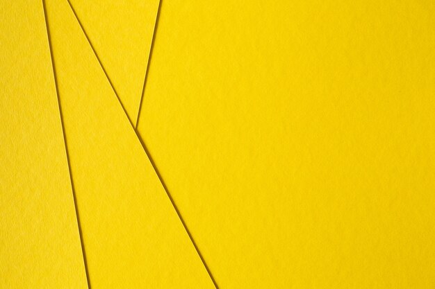 Fondo amarillo abstracto de la cartulina