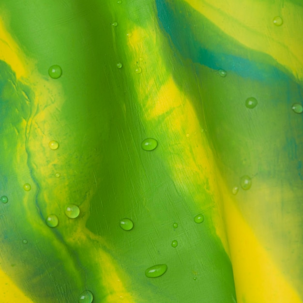Fondo de arcilla tie dye en estilo abstracto de arte creativo hecho a mano verde