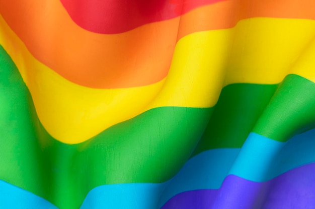 Fondo de bandera de arco iris LGBTQ + en textura de arcilla de plastilina DIY