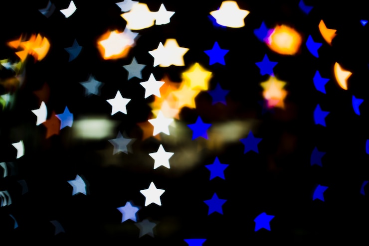 Foto gratuito fondo bokeh con luces en forma de estrellas