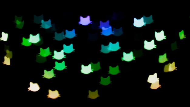 Fondo bokeh con luces de forma de gatos