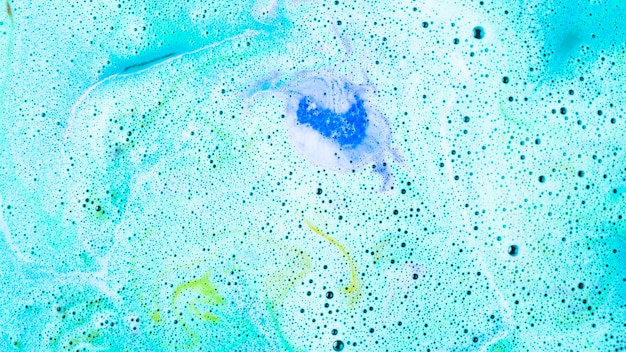 Fondo de bomba de baño de burbuja de cuidado de cuerpo azul