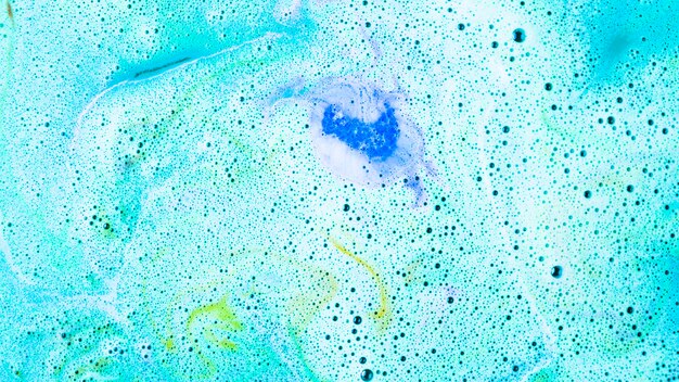 Fondo de bomba de baño de burbuja de cuidado de cuerpo azul