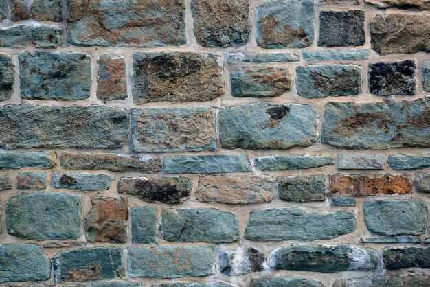 Fondo colorido de la pared de ladrillo del edificio viejo en la ciudad de Quebec