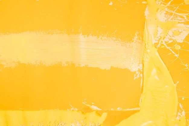 Fondo creativo amarillo de salpicaduras de pintura