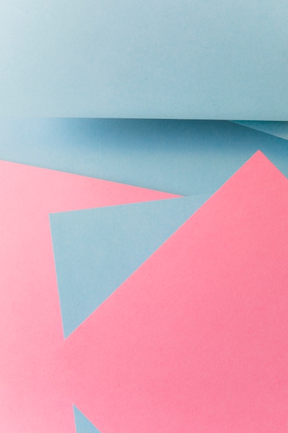Fondo geométrico abstracto del papel del color gris y rosado de la forma