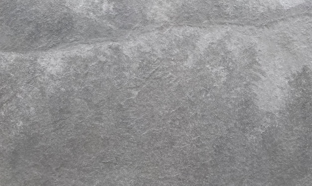 Foto gratuita un fondo gris con un patrón texturizado de una pared de piedra.