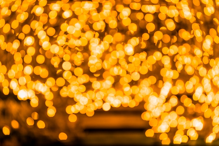Foto gratuito el fondo de luces antiguas de brillo dorado
