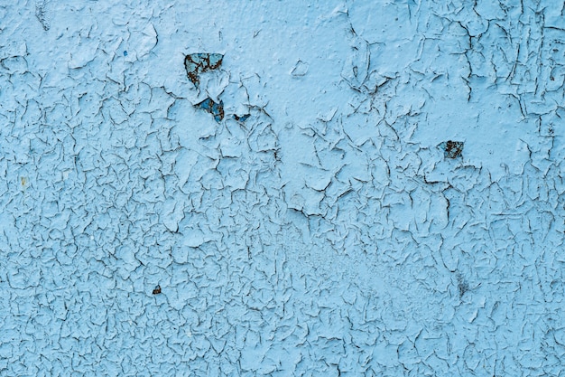 Fondo de metal grunge pintado azul o textura con arañazos y grietas