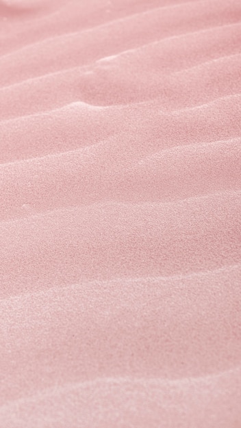 Foto gratuita fondo de pantalla móvil de arena rosa natural en la playa