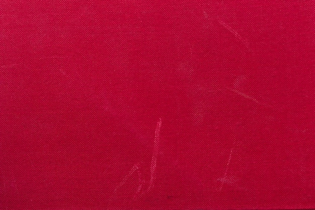 Fondo de pantalla de textura brillante del libro de tapa dura rojo.